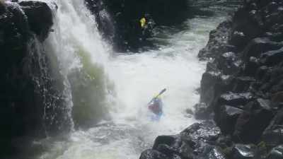 Paddling and battling
through the waterfall... - Edge of the Earth