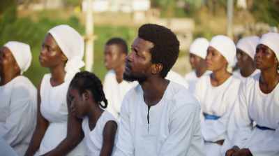 PASTOR: [in Twi] There's a message
in it that can transform your life. - The Burial of Kojo