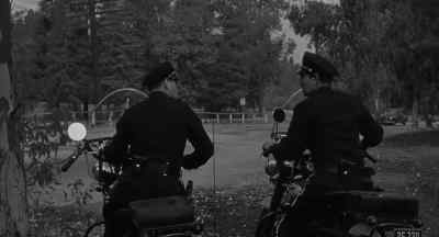'Patrol car 557
passing third street area. - Creature with the Atom Brain