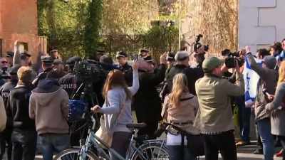 (people chanting and shouting
in German) - The Accountant of Auschwitz