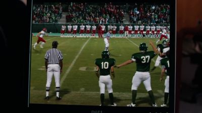 [PLAYERS YELLING
AND CROWD CHEERING OVER COMPUTER] - The Blind Side