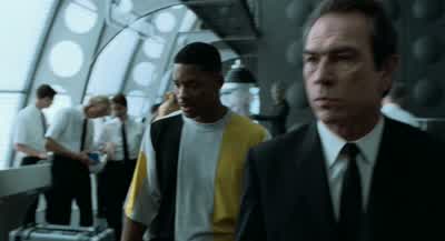 Please meet your party outside the containment area. - Men in Black