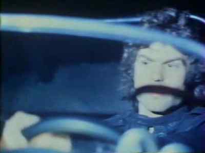 Policeman over loudspeaker: Okay, pull the plug. You're boxed. - King of the Mountain