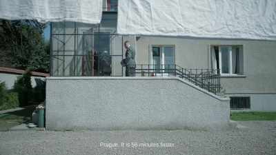 Prague. It is 56 minutes faster. - The Zone of Interest