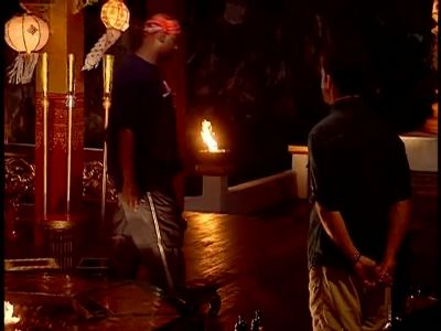 PROBST: As you walk in, grab
a torch, approach the flame. - Survivor
