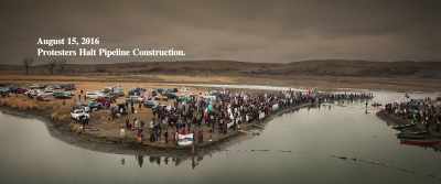 [protesters shouting] - On Sacred Ground