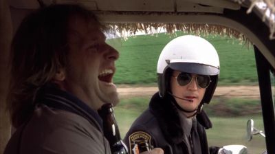 Huh Pull overNo it's a cardigan but thanks for noticingYeah Killer boots manPull your vehicle to the side of the roadLicense and registration pleaseYou fellas were going a little fast back there wouldn't you sayYou uh you fellas been doinga bit of boozing - Dumb and Dumber