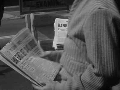 -  Read all about
the big bank hold up. - Machine Gun Kelly