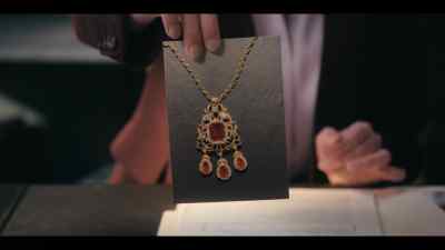 Recently, her son Evan reported
that this ruby necklace, - A Man on the Inside