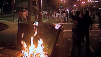 REPORTER: Crowds soon began
throwing rocks and bottles - Sound of the Police