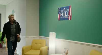 REPORTER [over TV]:
Campaign manager John Wesley - God's Not Dead: In God We Trust