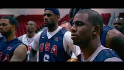 [rhythmic music playing faintly
over speakers] - The Redeem Team