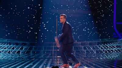 - Robbie didn't come.
- ♪ Jesus really tried for me... ♪ - Robbie Williams