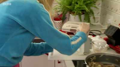 Rochelle's using another '80s gadget to open her baked beans - Back in Time for Dinner