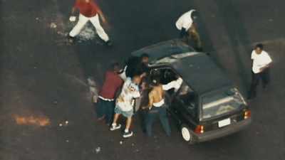 ROCKS AND BOTTLES BEING
THROWN AT ANOTHER CAR. - LA 92