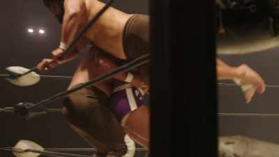 Rocky backbody drops Afa
over the top rope. - Young Rock