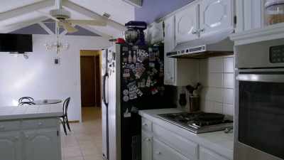 [Russell] So this space here,
if I open that refrigerator, - Renovation Impossible