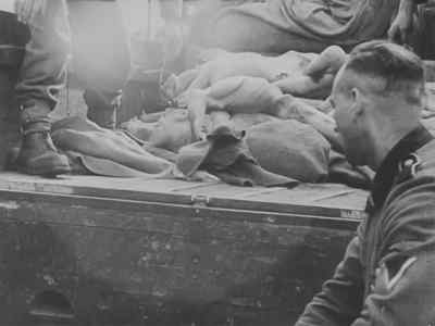 S.S. guards were impressed
to clean up the camp area. - Nazi Concentration Camps