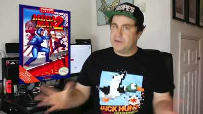 Sadly, yes, he is
waving about a pistol - Video Game Box Art: The Stories Behind the Covers