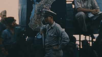 SAILORS GET AN
EMERGENCY BRIEFING - The Pacific War in Color