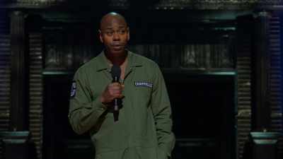 Same thing that always saves
this country from itself, - Dave Chappelle: Sticks &amp; Stones