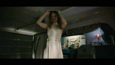 Sara takes her position
back on the couch. - The Unusual Suspects