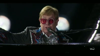 ♪ Say, Candy and Ronnie
have you seen them yet? ♪ - Elton John Live: Farewell from Dodger Stadium