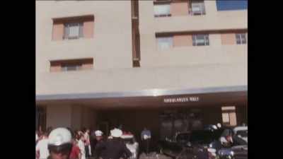 Secret Service men standing
by the emergency room, - First Ladies