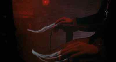 Separate filaments exuding
from fingertips of both hands, - The Legend of Hell House