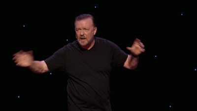 She was at the blackboard.
She was doing calling-out suggestions. - Ricky Gervais: SuperNature