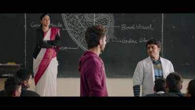 She is dressed in white,
with a pink stole. - Kabir Singh