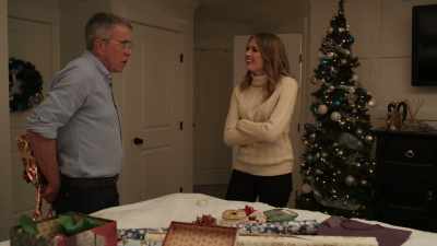 She holds a gift,
she looks at it, she knows. - Spotlight on Christmas