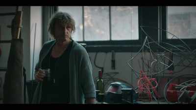 She needs a story
to explain the photos - The Unusual Suspects