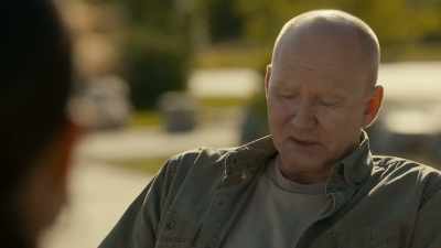 She sits and looks at her phone. - Burden of Truth