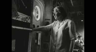 She stands up and looks out
with some excitement. - Golda