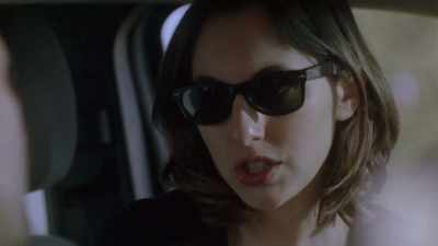 She takes the head in her mouth, - Between the Temples