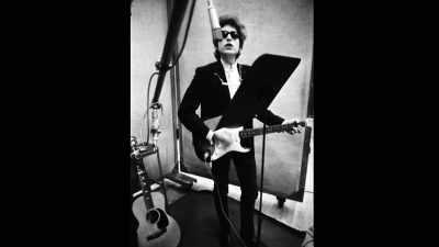 ♪ She's got everything
she needs - Bob Dylan: Odds and Ends