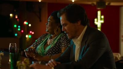 She's kissing him.
Saying, "Oh, Shriver." - A Little White Lie