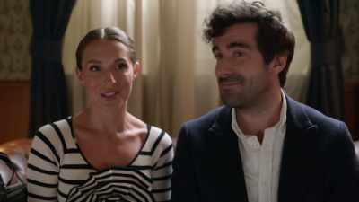 She's not overly impressed,
so he gives her another box. - A Paris Proposal