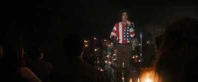 She's waving an American flag, - The Trial of the Chicago 7