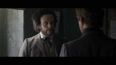 Silently.
No movement in the submarine. - The Young Karl Marx