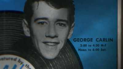 SINGERS: ♪ George Carlin
Is on the air... ♪ - George Carlin's American Dream
