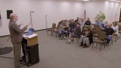[singing continues] - Who Is America?