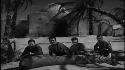 Sit down. Waiter. - The Lost Patrol