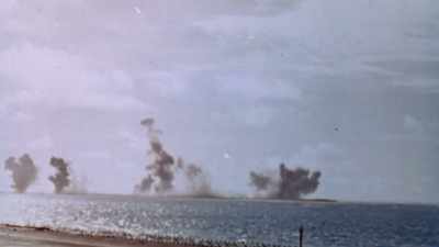 SMOKE BILLOWS HIGH INTO THE SKY - The Pacific War in Color