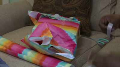 So now I'm sitting here
wrapping these gifts, - Inmate to Roommate