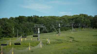 [soft dramatic music] - Class Action Park
