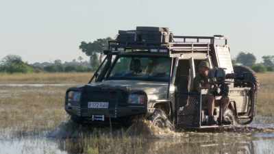 Spending day after day
filming the elephants, - In the Footsteps of Elephant