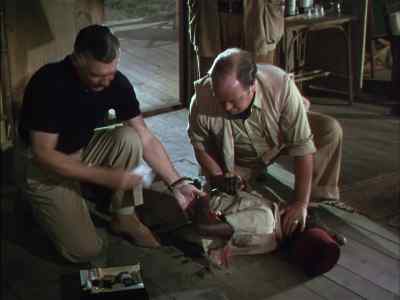 Strap him up, Brownie. - Mogambo