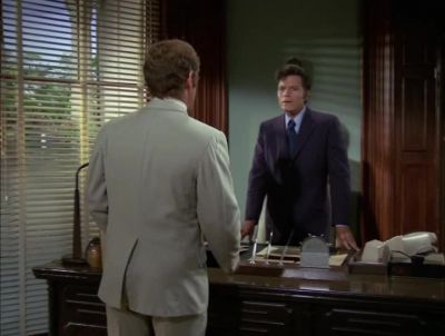 SURE ENOUGH, THEY CHECKED
A SUITCASE AT THE DESK, - Hawaii Five-0